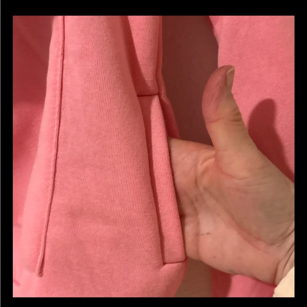 Pink sweatshirt that you can hold a small pet in.